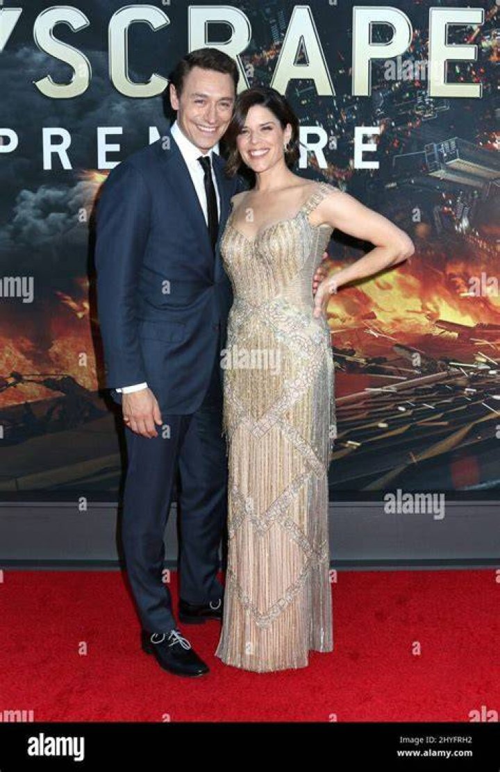 Neve Campbell & Husband JJ Feild attending the Derren Brown Secret