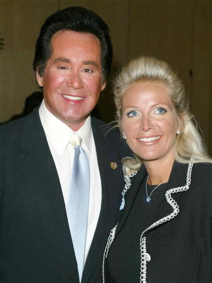Wayne Newton and his wife Kat Newton holding their newborn son, Carson