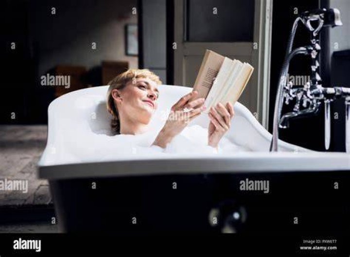 Woman taking bath with book in hands &middot; Free Stock Photo